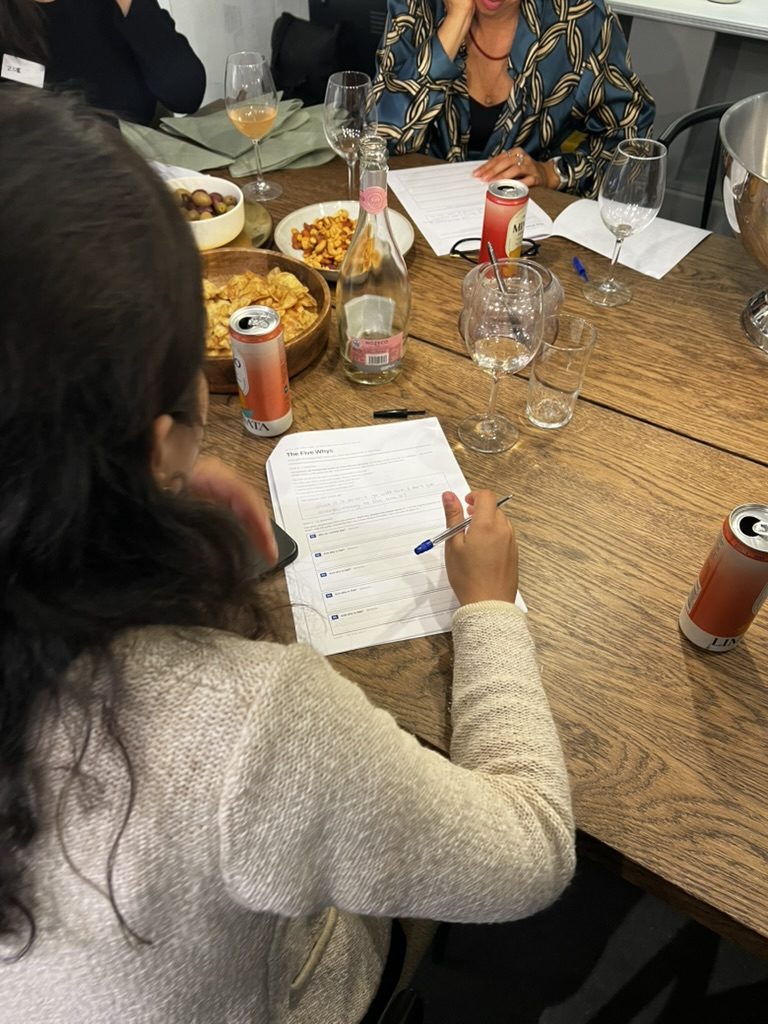 A participant filling in a worksheet during an evening session